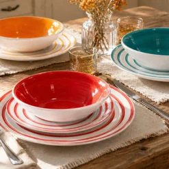 Servizio 18 piatti ceramica spirale colorati Ischia